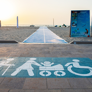 Accessible beach pathway with signage for elderly, stroller, and wheelchair users