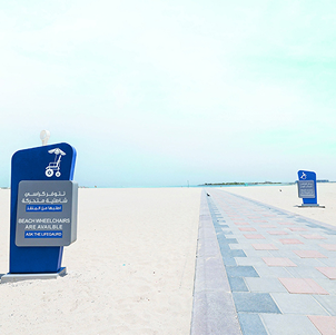 Beach sign indicating the availability of beach wheelchairs on the accessible pathway